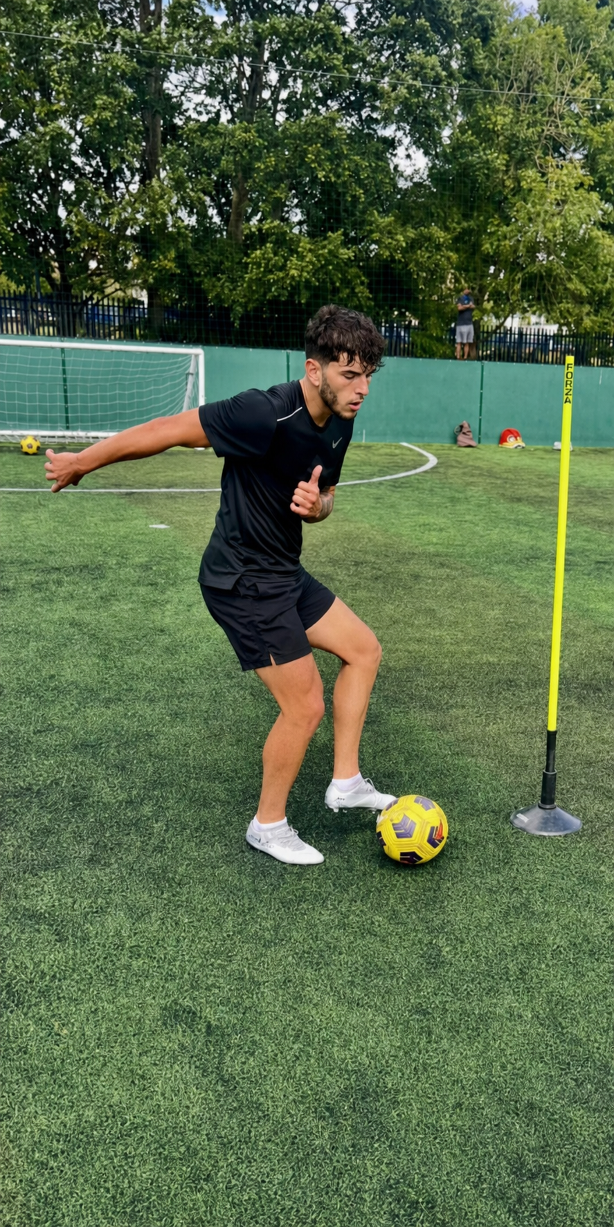 Player controlling the ball beside a training pole during a real 3T Coaching session